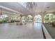 Large, airy common area with high ceilings, chandeliers, and plenty of natural light at 1 John Anderson Dr # 1070, Ormond Beach, FL 32176