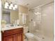 Bathroom with walk-in shower, toilet, and wood vanity at 1 John Anderson Dr # 1070, Ormond Beach, FL 32176