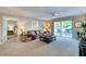 Living area with leather sofa, access to bedroom and balcony at 1 John Anderson Dr # 1070, Ormond Beach, FL 32176