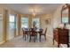 Charming dining room with wood table and chairs at 1 John Anderson Dr # 1070, Ormond Beach, FL 32176