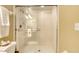 Walk-in shower with glass enclosure and white tile at 1 John Anderson Dr # 1070, Ormond Beach, FL 32176