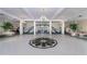 Bright and spacious lobby with high ceilings, chandelier, and seating areas at 1 John Anderson Dr # 1070, Ormond Beach, FL 32176