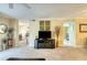 Open living area with TV and access to other rooms at 1 John Anderson Dr # 1070, Ormond Beach, FL 32176
