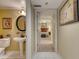 Hallway view of bedroom with carpet flooring and artwork at 1 John Anderson Dr # 1070, Ormond Beach, FL 32176
