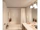 Elegant bathroom featuring a large bathtub, double vanity, and a walk-in shower at 1 John Anderson Dr # 1070, Ormond Beach, FL 32176