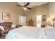 Lovely bedroom with a king bed, sitting area and ensuite bath at 3836 Long Grove Ln, Port Orange, FL 32129