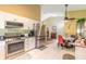 Bright kitchen with stainless steel appliances and an adjacent dining area at 3836 Long Grove Ln, Port Orange, FL 32129