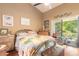 Bright bedroom with a queen bed, dresser, and access to a patio at 3836 Long Grove Ln, Port Orange, FL 32129