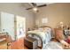 Cozy main bedroom with a comfortable bed and access to the bathroom at 3836 Long Grove Ln, Port Orange, FL 32129