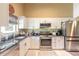 Well-equipped kitchen featuring stainless steel appliances and white cabinetry at 3836 Long Grove Ln, Port Orange, FL 32129