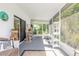 Relaxing screened porch with ample space for seating and enjoying the outdoors at 3836 Long Grove Ln, Port Orange, FL 32129