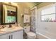 Clean bathroom with a tub shower combo and updated vanity at 3836 Long Grove Ln, Port Orange, FL 32129