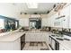 Kitchen with white cabinets, modern appliances, and a breakfast bar at 399 Foxhill Dr, Debary, FL 32713