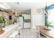 Kitchen dining area with white cabinets, oval table, and blue accent wall at 399 Foxhill Dr, Debary, FL 32713