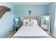Serene bedroom with a light blue wall and comfortable bed at 399 Foxhill Dr, Debary, FL 32713