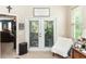 Relaxing sunroom with comfortable seating and plenty of plants at 399 Foxhill Dr, Debary, FL 32713