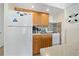 Small, well-equipped kitchen with wood cabinets at 2301 S Atlantic Ave # 236, Daytona Beach Shores, FL 32118