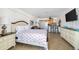 Comfortable bedroom with a queen-size bed and en-suite bathroom at 2301 S Atlantic Ave # 236, Daytona Beach Shores, FL 32118