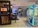 Game room featuring various arcade games and prize machines at 2301 S Atlantic Ave # 236, Daytona Beach Shores, FL 32118