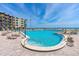 Inviting outdoor pool area with lounge chairs at 2301 S Atlantic Ave # 236, Daytona Beach Shores, FL 32118