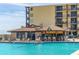 Refreshing pool area with bar and lounge chairs at 2301 S Atlantic Ave # 236, Daytona Beach Shores, FL 32118