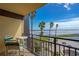 Ocean view balcony with table and chairs at 2301 S Atlantic Ave # 306, Daytona Beach Shores, FL 32118