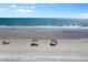 Relaxing beach scene with umbrellas and ocean view at 2301 S Atlantic Ave # 306, Daytona Beach Shores, FL 32118