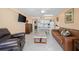 Open concept living room with comfortable seating and ocean view at 2301 S Atlantic Ave # 306, Daytona Beach Shores, FL 32118