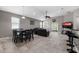 Open living room and dining area with tile floors and sliding glass doors at 537 Champion Ridge Dr, Daytona Beach, FL 32124