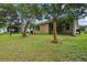 View of home's exterior and spacious backyard at 537 Champion Ridge Dr, Daytona Beach, FL 32124