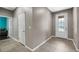 Bright entryway with tile flooring, coat closet, and view into living area at 537 Champion Ridge Dr, Daytona Beach, FL 32124