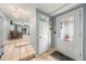 Clean entryway with tile flooring, coat closet, and view to dining area at 246 Angeles Rd, Debary, FL 32713