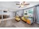 Living room features wood-look floors, comfy seating, and access to the backyard at 246 Angeles Rd, Debary, FL 32713
