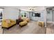 Living room with gray walls, laminate wood floor, and built in cabinets at 246 Angeles Rd, Debary, FL 32713