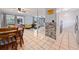 Open concept dining area with wood table and chairs, view of living room at 246 Angeles Rd, Debary, FL 32713