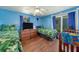Guest bedroom with twin beds and wood-look floors at 246 Angeles Rd, Debary, FL 32713