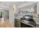Modern kitchen with stainless steel appliances and granite countertops at 246 Angeles Rd, Debary, FL 32713