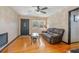 Living room with hardwood floors and a brown leather couch at 333 Beresford Ave, Deland, FL 32724