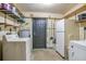 Laundry room with washer, dryer, and extra storage at 333 Beresford Ave, Deland, FL 32724