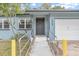 House entrance with ramp access and freshly painted siding at 333 Beresford Ave, Deland, FL 32724