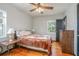Cozy bedroom with hardwood floors and a ceiling fan at 333 Beresford Ave, Deland, FL 32724