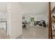 Open living room and kitchen with tile floors and modern design at 370 Sunset Point Dr, Ormond Beach, FL 32174