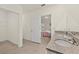 Bathroom with double vanity, granite countertops, and shower at 370 Sunset Point Dr, Ormond Beach, FL 32174