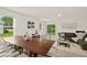 Modern dining room with wooden table and clear chairs at 370 Sunset Point Dr, Ormond Beach, FL 32174