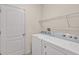 Laundry room with washer, dryer, and overhead shelving at 370 Sunset Point Dr, Ormond Beach, FL 32174