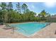 Relaxing community pool with lounge chairs at 370 Sunset Point Dr, Ormond Beach, FL 32174