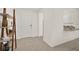 Bright entryway with tile flooring, built-in shelving, and view of kitchen at 370 Sunset Point Dr, Ormond Beach, FL 32174