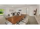 Dining room with wooden table and view into kitchen at 370 Sunset Point Dr, Ormond Beach, FL 32174