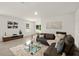 Bright living room with sectional sofa and glass coffee table at 370 Sunset Point Dr, Ormond Beach, FL 32174