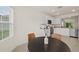 Kitchen features a breakfast nook with a round table and chairs at 370 Sunset Point Dr, Ormond Beach, FL 32174